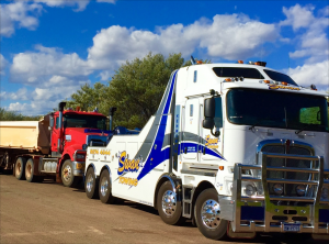 Swan Towing truck towing a truck that has broken down.
